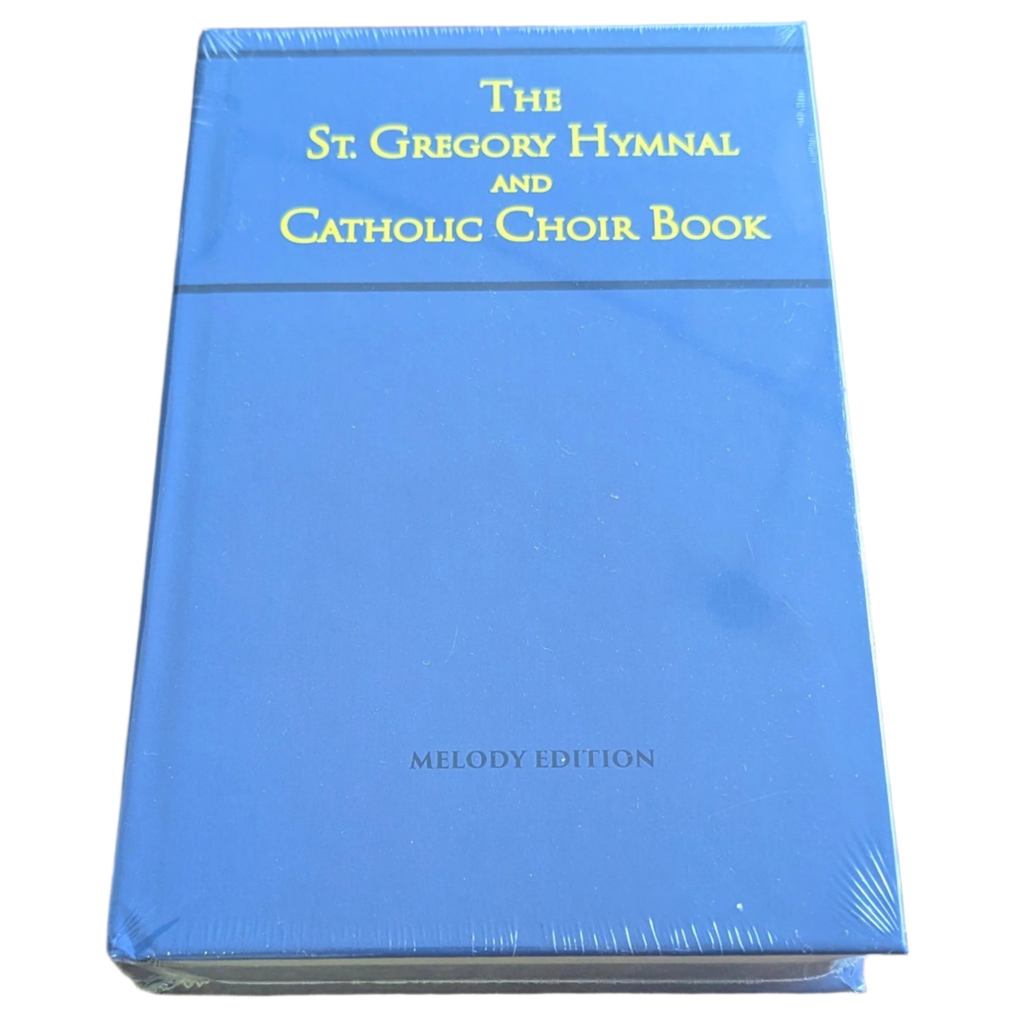 Blue book titled 'The St. Gregory Hymnal and Catholic Choir Book' on a wooden surface